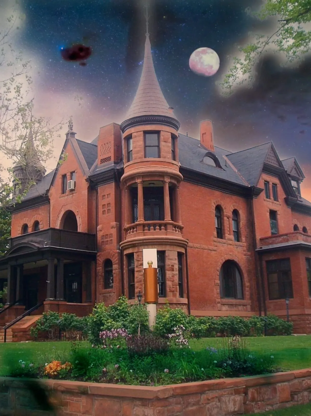 An old Victorian home beneath a full moon, the Academy's future community home